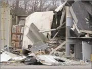  ?? Kevin Myrick / The Polk County Standard Journal ?? A car lies crushed Tuesday after this weekend’s explosion at JCG Farms Feed Mill in Rockmart.