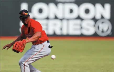  ?? AP PHOTO ?? Boston Red Sox third baseman Marco Hernandez fields a ball during batting practice in London on Friday. Major League Baseball will make its European debut with the New York Yankees versus Boston Red Sox game at London Stadium today.