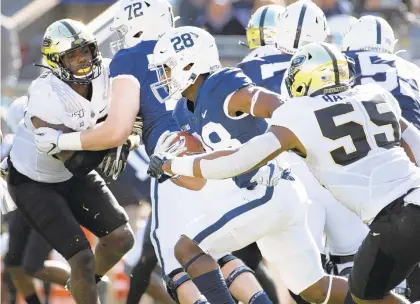  ?? BARRY REEGER/AP ?? Penn State running back Devyn Ford (28) gains yardage against Purdue during a football game in State College on Oct. 5.