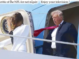  ?? REUTERS ?? US President Donald Trump and his wife Melania are buffeted by the wind as they emerge from Air Force One arriving in Columbus, Ohio on Friday.