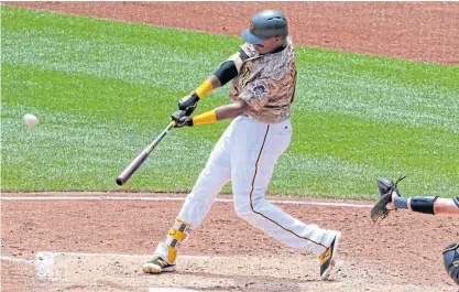  ??  ?? The Pirates’ Gregory Polanco hits a solo home run off the Brewers’ starting pitcher Jimmy Nelson in the fourth inning.