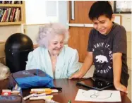  ??  ?? Fourth grader Joel Garcia, right, shows Delma Rea Stewart how an ozobot works.