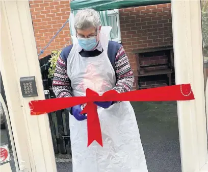  ??  ?? ●●Neil Williams cuts the ribbon at Half Acre House