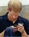  ??  ?? On phone: Prince Harry