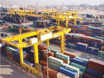  ?? Bloomberg ?? Containers for APL and China Shipping at DP World’s Jebel Ali Port in Dubai. Moody’s has acknowledg­ed DP World’s growing scale and geographic footprint.