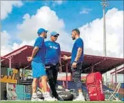  ?? PTI PHOTO ?? (From left) MS Dhoni, coach Anil Kumble and Virat Kohli have a chat ahead of a team practice session on Friday.