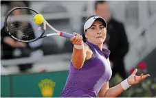  ?? ANDREW MEDICHINI THE ASSOCIATED PRESS ?? Bianca Andreescu returns the ball to Emma Raducanu during their match at the Italian Open tennis tournament, in Rome, on Tuesday. Andreescu won 6-2, 2-1 after Raducanu was forced to withdraw due to a back injury.
