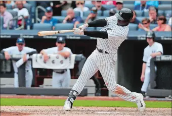  ?? JULIE JACOBSON/AP PHOTO ?? Didi Gregorius connects for a two-run home run, his fourth homer in three games, during the seventh inning of the Yankees’ 9-5 win over the Cincinnati Reds on Wednesday in New York.