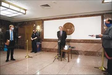  ?? Caroline Brehman CQ-Roll Call ?? SEN. JOHN KENNEDY (R-La.) speaks to reporters in the Capitol this month. Congress has largely been operating remotely since early March. The Senate returned to Washington this week.