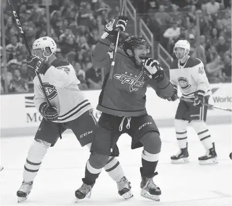  ?? NICK WASS/THE ASSOCIATED PRESS ?? Washington Capitals left winger Alex Ovechkin celebrates his third goal against the Montreal Canadiens on Saturday in Washington, D.C. Ovechkin scored four in Saturday’s game after a three-goal night against the Senators last Thursday in Ottawa.