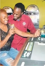  ?? PHOTOS BY OKOYE HENRY ?? Customers enjoying a drink at the lively sports bar.