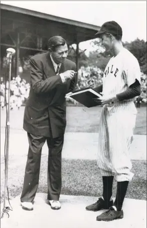  ?? New Haven Register / Hearst Connecticu­t Media file photo ?? George H.W. Bush welcomes Babe Ruth at a pregame ceremony at the Yale University Field in June 1948. Bush was then captain of the 1948 varsity team. It was one of Ruth’s last public appearance­s, as he died later that summer.