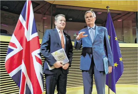  ?? PHOTO: OLIVER HOSLET/POOL VIA REUTERS ?? Negotiatio­n: Michel Barnier (right) and David Frost are set for more talks.