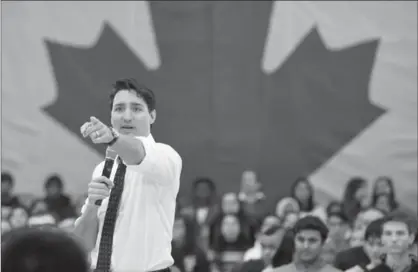  ?? BARRY GRAY, THE HAMILTON SPECTATOR ?? Prime Minster Justin Trudeau fields a question at a town-hall meeting at McMaster University. Tim Harper reminds the prime minister that softball questions about his legacy won’t be on the order paper back in Ottawa.