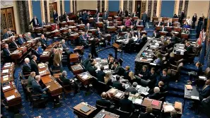  ?? Associated Press ?? ■ In this image from video, Senators cast their vote on the motion to allow additional witnesses and evidence in the impeachmen­t trial against President Donald Trump on Friday in the Senate at the U.S. Capitol in Washington. The motion failed with a vote of 51-49.