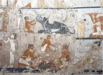  ?? — AFP ?? Well-preserved and rare wall paintings inside the tomb of an Old Kingdom priestess in Saqqara, on the Giza plateau on the southern outskirts of Cairo, that was unveiled on Saturday, after being discovered during excavation work in Giza’s western...