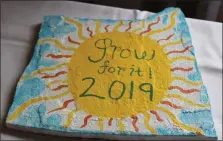  ?? PHOTO BY MICHILEA PATTERSON – FOR MEDIANEWS GROUP ?? A painted flagstone with the words “grow for it” is on display during the 2019 Home Garden Contest awards ceremony. First-place winners of the competitio­n received a flagstone to take home with them.