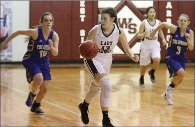  ?? Terrance Armstard/News-Times ?? Break the press: West Side Christian's Olivia Voss dribbles the ball up the court against Columbia Christian's Madison Williamson (10) who tries to chase her down from behind. The Lady Warriors fell to the Lady Crusaders 46-43 Saturday in the AACS...