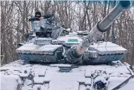  ?? LIBKOS/ ASSOCIATED PRESS ?? A Ukrainian tank is seen in position on the frontline in Bakhmut in Donetsk region on Sunday.