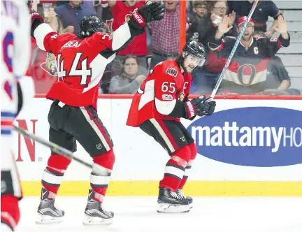  ?? JEAN LEVAC ?? Erik Karlsson celebrates his game-winning goal against the New York Rangers with Senators teammate Jean-Gabriel Pageau during the third period of Game 1 in their Eastern Conference semifinal series against the New York Rangers on Thursday evening.