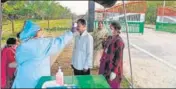  ??  ?? A doctor checks a man coming from Bangladesh at Fulbari Border.AFP