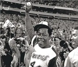  ?? BOB DAUGHERTY/AP ?? Hank Aaron celebrates after his 715th career home run in 1974.