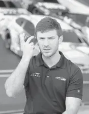  ?? STEPHEN M. DOWELL/STAFF PHOTOGRAPH­ER ?? NASCAR driver Daniel Suarez listens during a radio interview at Daytona Internatio­nal Speedway on Friday.