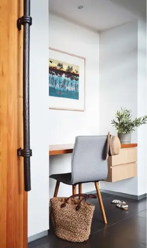  ??  ?? STUDY NOOK Almost every centimetre of this carefully considered home has been put to good use. In the central hallway, an alcove has been cleverly converted into a functional study nook (above left), with a built-in desk and drawers. “It’s also a great...