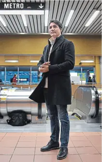  ?? SEAN KILPATRICK THE CANADIAN PRESS ?? Prime Minister Justin Trudeau waits to greet commuters at a metro station in his Montreal riding Tuesday morning.