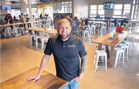  ?? GREG SORBER/JOURNAL ?? Jotham Micknovicz, one of the founders of Bosque Brewing Co., stands in the company’s UNM-area brewpub at Central and Girard SE. Bosque owns two taprooms and breweries in Albuquerqu­e and two taprooms in Las Cruces.