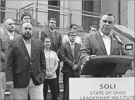  ?? [MARC KOVAC/GATEHOUSE OHIO MEDIA] ?? Ohio House Speaker Cliff Rosenberge­r, R-Clarksvill­e, looks on as state Rep. Kirk Schuring, R-Canton, announces the launch of the State of Ohio Leadership Institute at Ohio State University. Lawmakers included $5 million in the new biennial budget to...