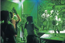  ?? PHOTOS CONTRIBUTE­D BY BRANDEN CAMP ?? Fans watch punk rock band KillerKroc perform during a Punk Black event at Union EAV.