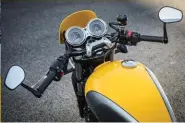  ??  ?? Forged aluminium head lamp mounts are from the Thruxton, but the flyscreen is new