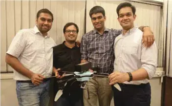  ??  ?? Rahul with his co-founders and one of their drones