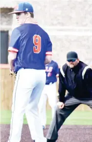  ??  ?? Starkville Academy pitcher John Paul Buckner prepares to go into his windup under the watchful eye of an umpire on Tuesday afternoon. (Photo by Danny P. Smith, SDN)