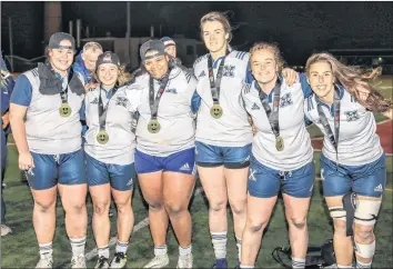  ?? PHOTO COURTESY OF GARY MANNING ?? Two Windsor members of the St. Francis Xavier University X-Women rugby team, Sam Lake (far left) and Sophie Parker (far right) took home gold medals after defeating Guelph in the finals. Both are also provincial champs from their high school days.