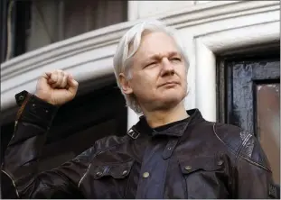  ?? FRANK AUGSTEIN — THE ASSOCIATED PRESS FILE ?? Julian Assange greets supporters outside the Ecuadorian embassy in London, Friday. The British government on Friday ordered the extraditio­n of WikiLeaks founder Julian Assange to the United States to face spying charges. He is likely to appeal.