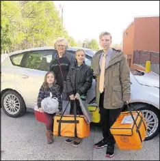  ?? PHOTO BY LAURA BERRIOS ?? Delivering Meals on Wheels to Cobb County seniors has been a rewarding family tradition for the Ingolds and their children and grandchild­ren. Pictured with Carolyn Ingold are her grandchild­ren, from left, Carter Brandon, 6; Kennedy Wilson, 13; and...