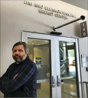  ?? LISA GRANADOS VIA AP ?? This photo provided by Lisa Granados shows Associated Press reporter Andrew Dalton standing outside the Jim and Eleanor Randall Breast Center. Dalton described his experience as the rare man who underwent a mammogram in a story for the AP.