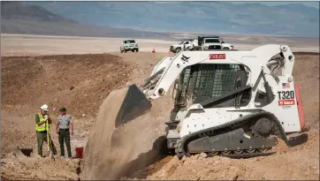  ?? Photo courtesy of the National Park Service ?? National Park Service staff backfill a trench after a water pipe repair. The agency is looking for public input on proposed utility improvemen­ts throughout Death Valley
National Park. These utilities provide services to visitors and residents as well.