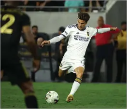  ?? PHOTO BY RAUL ROMERO JR. ?? The Galaxy posted a 4-1-5record in their final regular-season games and advanced to the Western Conference semifinals after midfielder Riqui Puig joined the team.