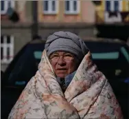  ?? ?? A Ukrainian woman waits at Przemysl train station in south eastern Poland after being among millions fleeing the war