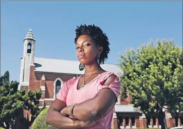  ?? CAROLYN COLE Los Angeles Times ?? ALEX MARSHALL-BROWN, an actress and stuntwoman, at St. Paul’s First Lutheran Church, where she was sitting when church members told her to leave the property. A video of the incident has gone viral.