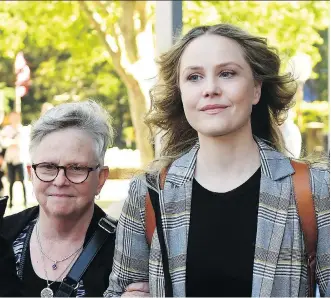  ?? DAN HIMBRECHTS/THE ASSOCIATED PRESS ?? Actress Eryn Jean Norvill, right, leaves the Federal Court in Sydney, Australia, after giving evidence during a defamation trial brought on by fellow actor Geoffrey Rush.