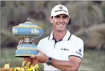  ?? DAVID J. PHILLIP / AP ?? Billy Horschel holds his trophy after winning the Dell Technologi­es Match Play Championsh­ip golf tournament Sunday in Austin, Texas.