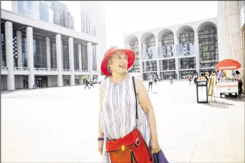  ?? DANNY GHITIS / THE NEW YORK TIMES ?? Susan Fischer, a linguistic­s professor from San Diego who retired to a two-bedroom apartment near Lincoln Center, looks at the architectu­re around Josie Robertson Plaza in New York last month. After being widowed in 2009, Fischer sought a change and...