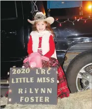  ??  ?? Rilynn Foster, 2020 Lincoln Rodeo Club Little Miss, bundled up to be in Prairie Grove’s Reverse Christmas Parade.