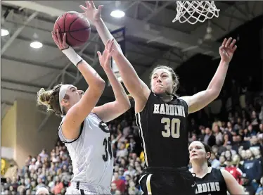  ?? Photos courtesy of Jeff Montgomery ?? Harding sophomore forward Caroline Hogue (right) has accumulate­d a number of accolades in her first season with the Lady Bisons, including being named the Central Region Tournament MVP last weekend during the NCAA Division II Tournament, but the former Baptist Prep standout has played with a heavy heart for the majority of 2017 after younger sister Kennedy died on Jan. 1.