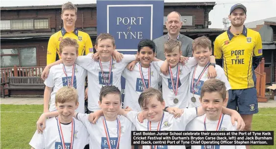  ??  ?? East Boldon Junior School celebrate their success at the Port of Tyne Kwik Cricket Festival with Durham’s Brydon Carse (back, left) and Jack Burnham and (back, centre) Port of Tyne Chief Operating Officer Stephen Harrison.