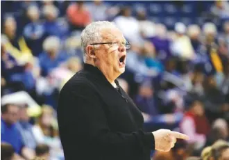  ?? STAFF PHOTO BY DOUG STRICKLAND ?? Jim Foster, UTC’s women’s basketball coach at the time, shouts instructio­ns to Mocs players during a home game against ETSU in February 2018.